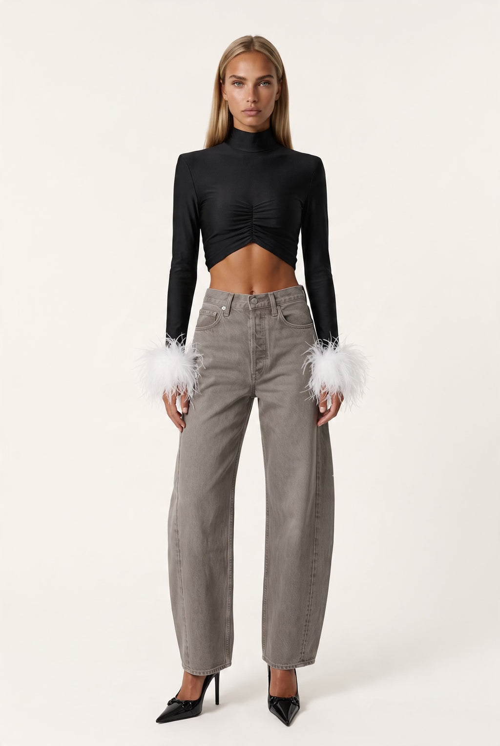The Saint 54 fitted black long-sleeve top with polo neckline, front gathering, and detachable white ostrich feathers.