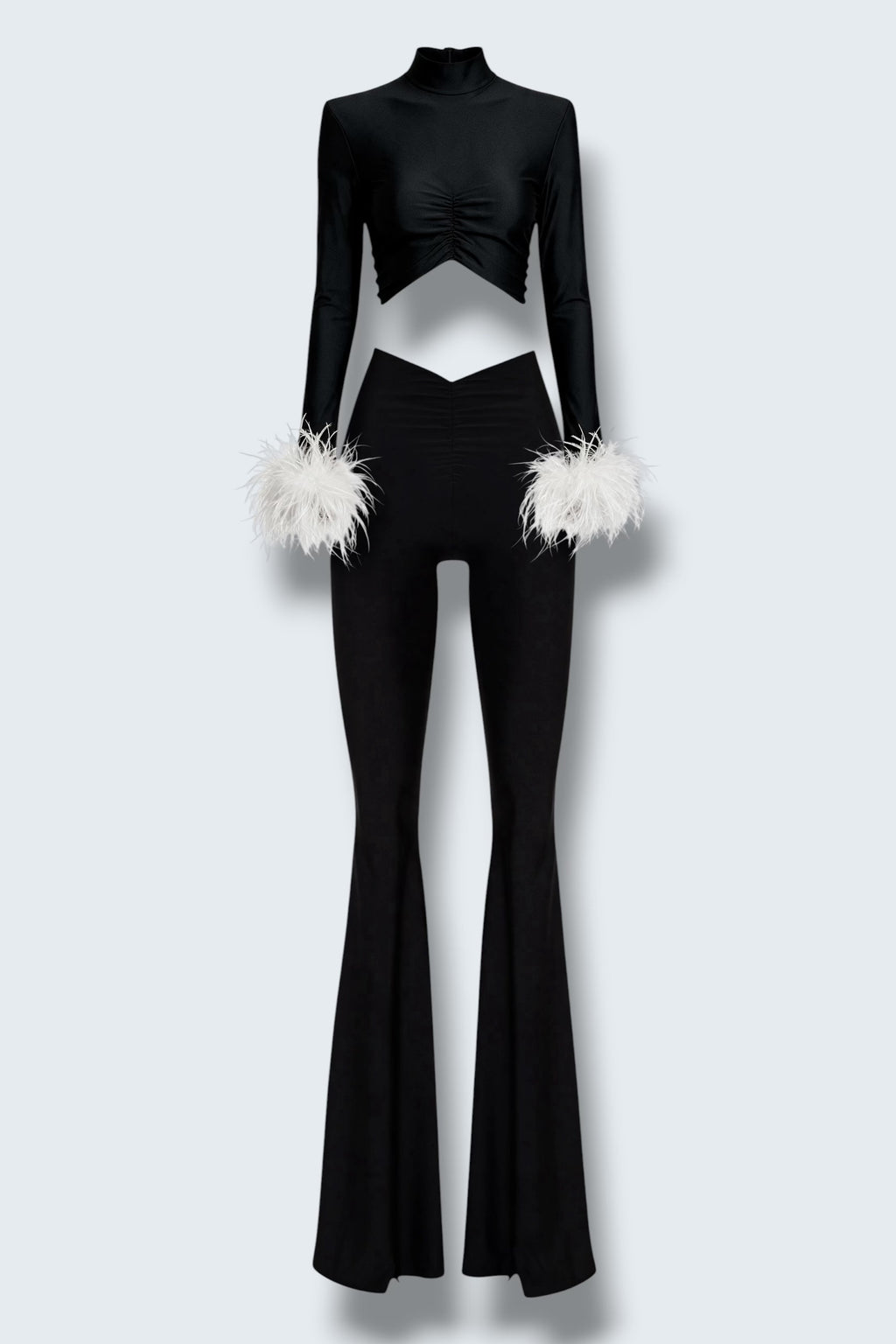 The Saint 54 black fitted polo top with detachable white ostrich feather cuffs and matching high-waisted flared pants.