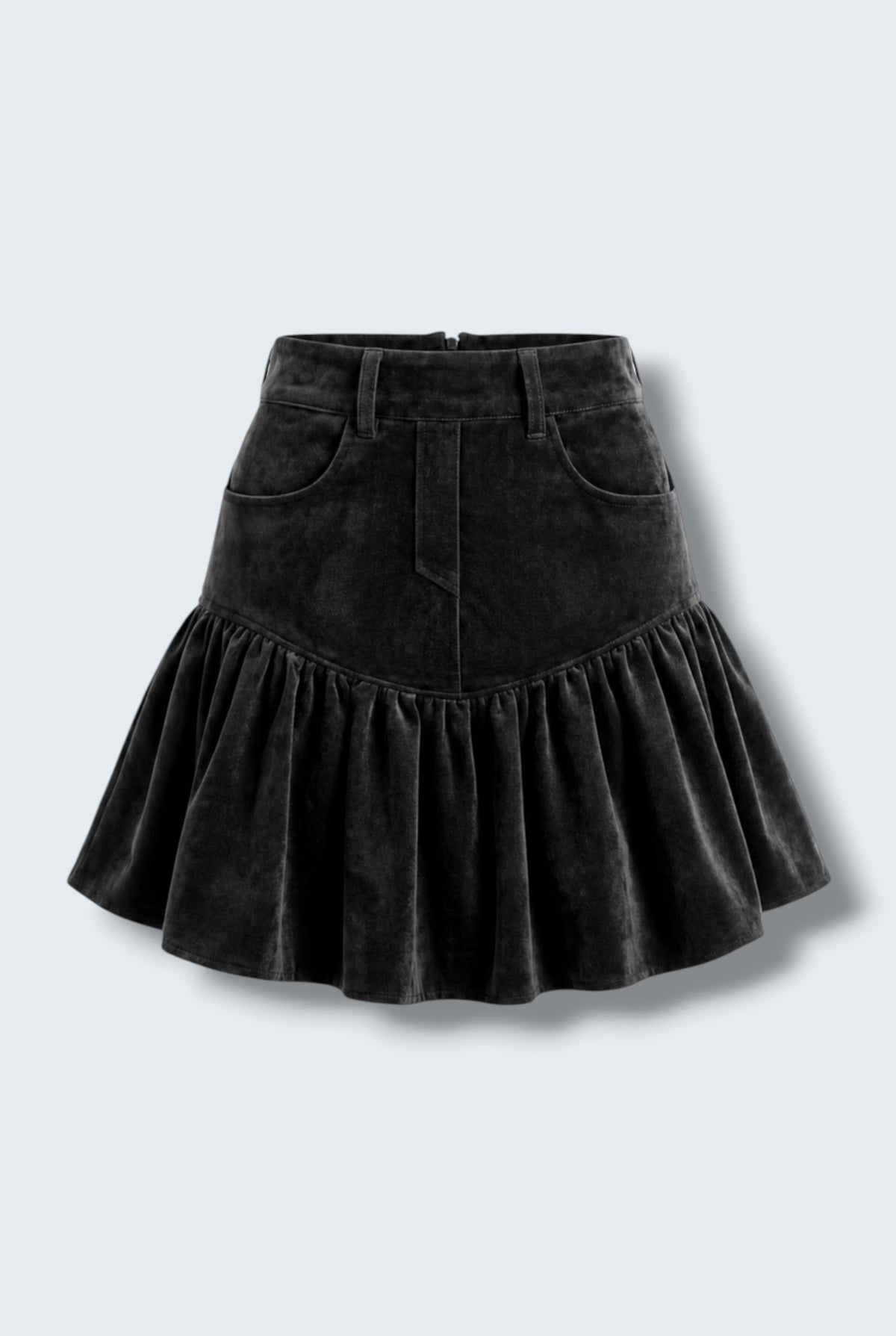 The Saint 54 black suede bomber jacket and ruffled mini skirt set worn by a model against a white background.
